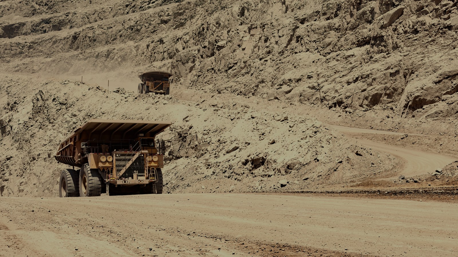 Haul trucks on the pit road.